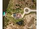 Overhead shot of a beautiful home showcasing pool, landscaping, dock, and circular driveway at 9149 Lane Ct, Port Charlotte, FL 33981