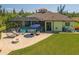 This backyard is perfect for relaxing with its screened lanai, pool and fire pit at 9149 Lane Ct, Port Charlotte, FL 33981