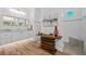 This modern bathroom features a custom vanity, designer mirror, and decorative, stack-wood display table at 9149 Lane Ct, Port Charlotte, FL 33981