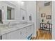 Bright bathroom features a dual sink vanity, plenty of storage, and designer mirrors at 9149 Lane Ct, Port Charlotte, FL 33981