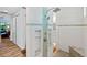 Stylish bathroom features a walk-in shower, built-in shelving, and designer tile at 9149 Lane Ct, Port Charlotte, FL 33981