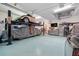 View of garage with car lift and a TV at 9149 Lane Ct, Port Charlotte, FL 33981