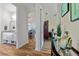 Hallway view showcases an open floor plan with a bath, living room, and bedroom at 9149 Lane Ct, Port Charlotte, FL 33981