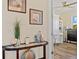 Hallway featuring a glass top table that leads into the bedroom with a built-in desk and storage at 9149 Lane Ct, Port Charlotte, FL 33981