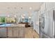 Spacious kitchen with a large island, stainless steel appliances, and a seamless flow into the living areas at 9149 Lane Ct, Port Charlotte, FL 33981