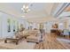 Spacious living room open to kitchen and dining area, featuring hardwood floors at 9149 Lane Ct, Port Charlotte, FL 33981