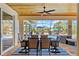 Outdoor patio with modern furniture and a stunning view of the pool and manicured backyard at 9149 Lane Ct, Port Charlotte, FL 33981
