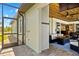 Outdoor shower and outdoor seating area featuring a summer kitchen, ceiling fan, and views of the pool at 9149 Lane Ct, Port Charlotte, FL 33981