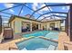Gorgeous pool with jacuzzi, large screened-in lanai, and outdoor kitchen at 9149 Lane Ct, Port Charlotte, FL 33981