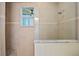 Stunning walk-in shower with marble bench, and glass enclosure, offering a spa-like experience at 9149 Lane Ct, Port Charlotte, FL 33981