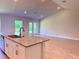 Modern kitchen features granite countertops, stainless steel sink, and an open floor plan at 9590 Little Rock St, Port Charlotte, FL 33981