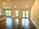 Open-concept living space featuring recessed lighting, tiled floors and access to the backyard at 9590 Little Rock St, Port Charlotte, FL 33981