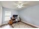 Bedroom with a light blue walls, ceiling fan, and a desk with two monitors at 10052 Winding River Rd, Punta Gorda, FL 33950