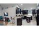 Contemporary kitchen featuring dark cabinets, granite countertops, and stainless steel appliances at 10052 Winding River Rd, Punta Gorda, FL 33950