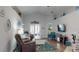Comfortable living room featuring stylish decor, hardwood floors, and a cozy atmosphere at 10052 Winding River Rd, Punta Gorda, FL 33950