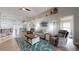 Comfortable living room with plush seating, stylish decor, wood floors, and lots of natural light at 10052 Winding River Rd, Punta Gorda, FL 33950
