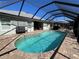 Inviting screened-in pool area, perfect for relaxing and entertaining in a private outdoor oasis at 10052 Winding River Rd, Punta Gorda, FL 33950