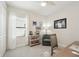 Bright bedroom features neutral decor, and a chair sitting near a window at 10112 Canaveral Cir, Sarasota, FL 34241