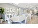 Bright dining area adjacent to the kitchen featuring coordinated decor and seamless access to the rest of the house at 10112 Canaveral Cir, Sarasota, FL 34241