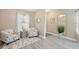 Cozy living room featuring stylish decor, ample natural light, and elegant flooring at 10112 Canaveral Cir, Sarasota, FL 34241