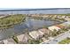 Lakeside community with private screened pools, palm trees, and manicured lawns, aerial view at 13096 N Marsh Dr, Port Charlotte, FL 33953