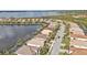 Overhead view of homes with pools and scenic lake views in a well-maintained community at 13096 N Marsh Dr, Port Charlotte, FL 33953