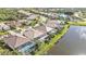 Aerial view of stunning homes by a serene lake, each with private screened-in pools at 13096 N Marsh Dr, Port Charlotte, FL 33953