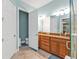 The primary bathroom features a double vanity with granite counters, toilet, and tiled shower at 13096 N Marsh Dr, Port Charlotte, FL 33953