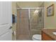 The secondary bathroom features a tiled shower, granite counters, and updated fixtures at 13096 N Marsh Dr, Port Charlotte, FL 33953