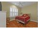 This bedroom features a bed with an ornate metal frame and shuttered windows at 13096 N Marsh Dr, Port Charlotte, FL 33953