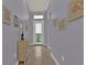 Hallway with light-purple walls leading to the home's front entrance at 13096 N Marsh Dr, Port Charlotte, FL 33953
