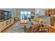 Comfortable living room with hardwood floors, blue walls, and view of the screened in patio at 13096 N Marsh Dr, Port Charlotte, FL 33953