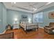 Spacious main bedroom with a tray ceiling, hardwood floors, and lots of natural light at 13096 N Marsh Dr, Port Charlotte, FL 33953