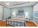 Light-filled main bedroom with tray ceilings and hardwood floors at 13096 N Marsh Dr, Port Charlotte, FL 33953