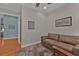 The home office features a comfortable sofa and views of other rooms at 13096 N Marsh Dr, Port Charlotte, FL 33953