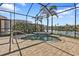 Beautiful screened-in pool with brick pavers and a view of the lake at 13096 N Marsh Dr, Port Charlotte, FL 33953