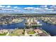 Expansive aerial view showcases this waterfront home in a vibrant, canal-filled community at 1336 Casey Key Dr, Punta Gorda, FL 33950