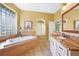 Bathroom featuring a soaking tub with a glass block window, granite countertops, and tile floors at 1336 Casey Key Dr, Punta Gorda, FL 33950