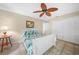 Guest bedroom featuring a ceiling fan, tile flooring, and a closet with bi-fold doors at 1336 Casey Key Dr, Punta Gorda, FL 33950