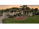 A well-maintained home with a lush front yard featuring mature palm trees at 1336 Casey Key Dr, Punta Gorda, FL 33950
