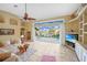 Bright living room boasting tile flooring, neutral tones, and a seamless transition to the outdoor pool area at 1336 Casey Key Dr, Punta Gorda, FL 33950