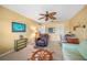 Office space offers a ceiling fan, leather recliner and desk area at 1336 Casey Key Dr, Punta Gorda, FL 33950