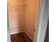 Walk-in closet with shelving and a view of the hardwood flooring at 1340 San Cristobal Ave # 207, Punta Gorda, FL 33983