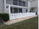 Back condo exterior showing a white fence for privacy and outdoor enjoyment at 1340 San Cristobal Ave # 207, Punta Gorda, FL 33983