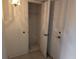 Hall closet next to front door, featuring tile flooring, a hanging rack, and a shelf at 1340 San Cristobal Ave # 207, Punta Gorda, FL 33983