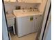 Practical laundry room with a washer, dryer, and utility sink at 1340 San Cristobal Ave # 207, Punta Gorda, FL 33983