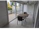 Relaxing screened patio featuring a table and chairs for outdoor enjoyment at 1340 San Cristobal Ave # 207, Punta Gorda, FL 33983