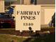 Fairway Pines community sign with manicured lawn and easy-to-see address at 1340 San Cristobal Ave # 207, Punta Gorda, FL 33983