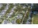 An aerial view of the property shows the layout, proximity to neighborhood, and the surrounding landscape at 1355 Red Oak Ln, Port Charlotte, FL 33948