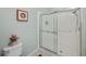 Clean bathroom featuring an enclosed shower, a toilet and neutral colored walls at 1355 Red Oak Ln, Port Charlotte, FL 33948